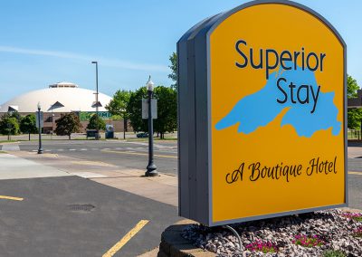 Superior stay hotel signage with superior dome in background